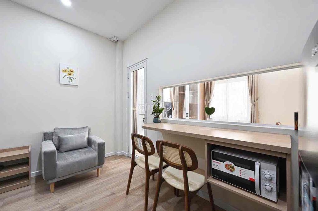 A super-spotty kitchen service apartment. An empty bedroom.