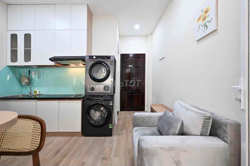 A super-spotty kitchen service apartment. An empty bedroom.