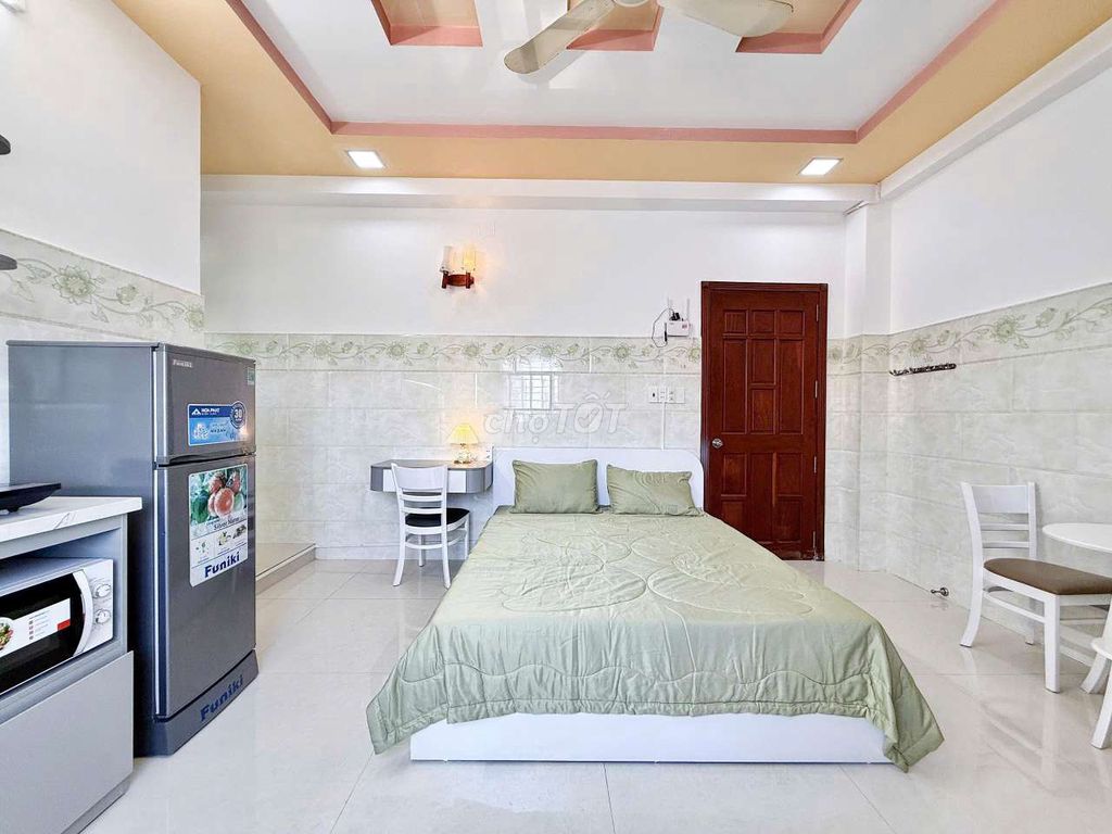 The new mini apartment is full of conveniences, the private washing machine right here.