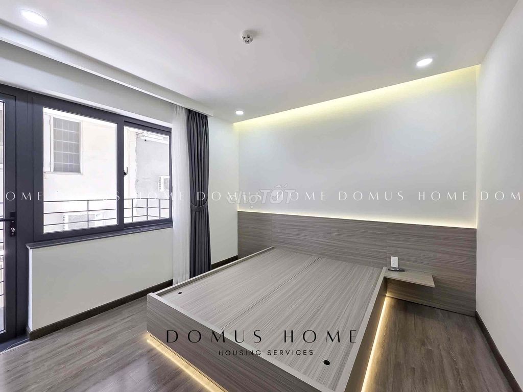 A balcony bedroom, private laundry of District 7.