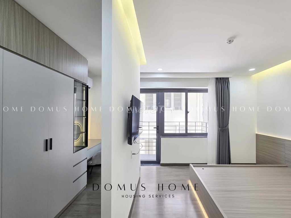 A balcony bedroom, private laundry of District 7.