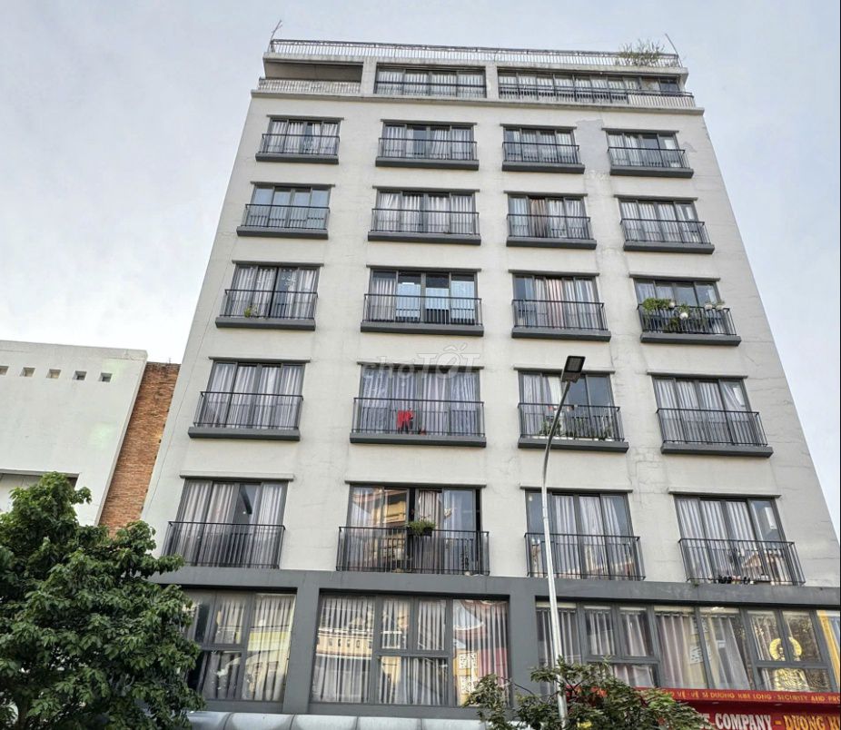 The mini apartment has a balcony. The bedroom is against District 1 3-house security.