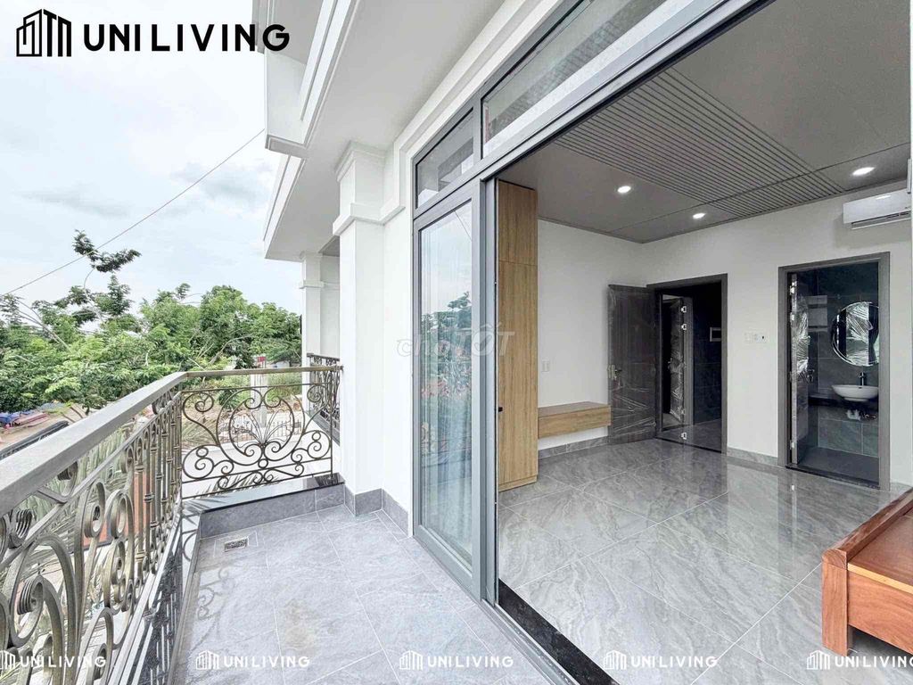 Room full interior, large glass balcony, natural light