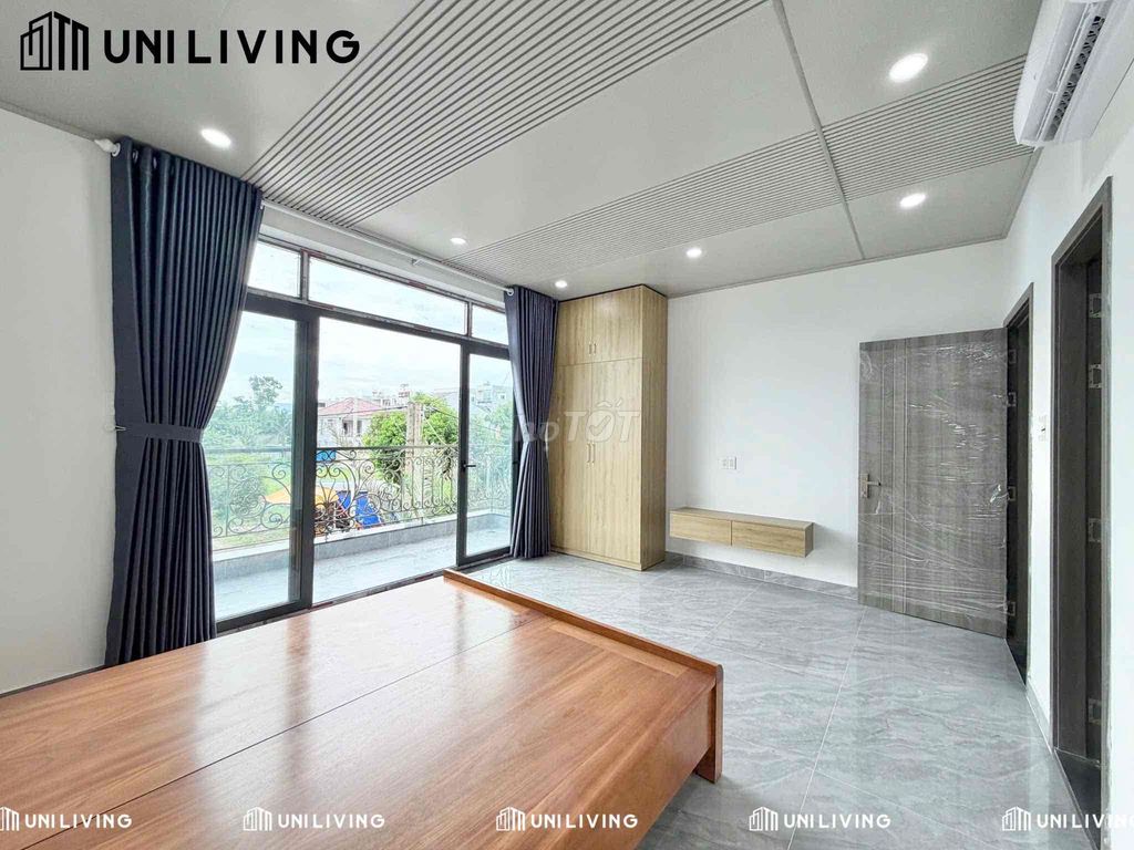 Room full interior, large glass balcony, natural light