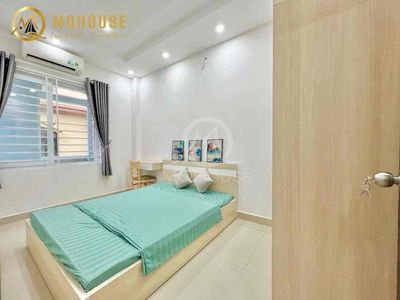 The full studio furniture and a balconctal wash-cleaning room.