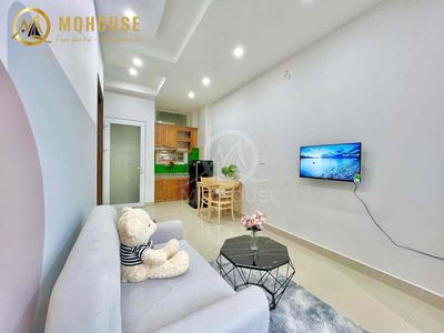 The full studio furniture and a balconctal wash-cleaning room.