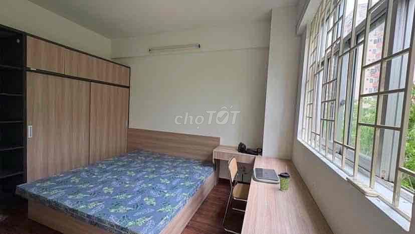 Two bedrooms open windows near the center.