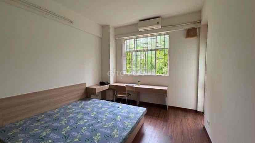 Two bedrooms open windows near the center.