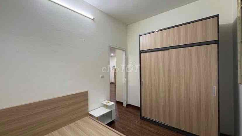 Two bedrooms open windows near the center.