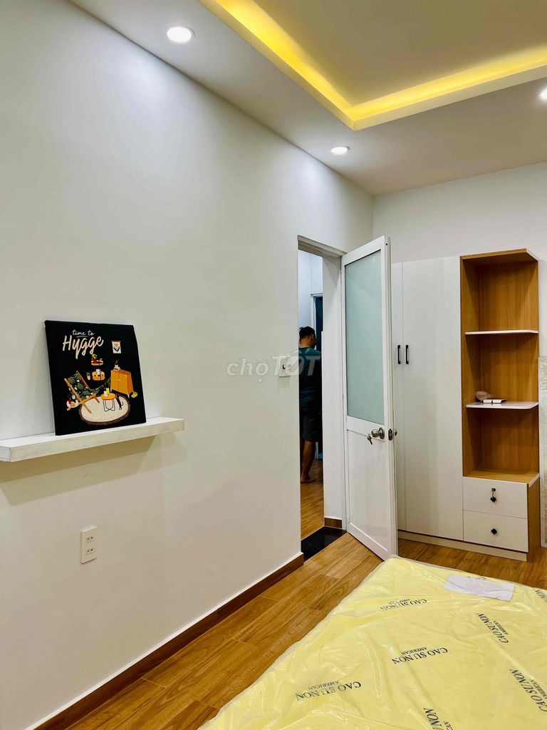 Two-room mini apartments, kitchen-four-year-olds, balconys and open windows.