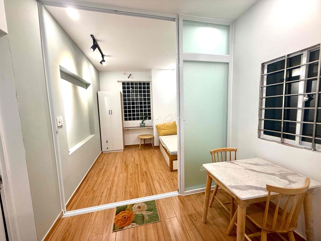 Two-room mini apartments, kitchen-four-year-olds, balconys and open windows.