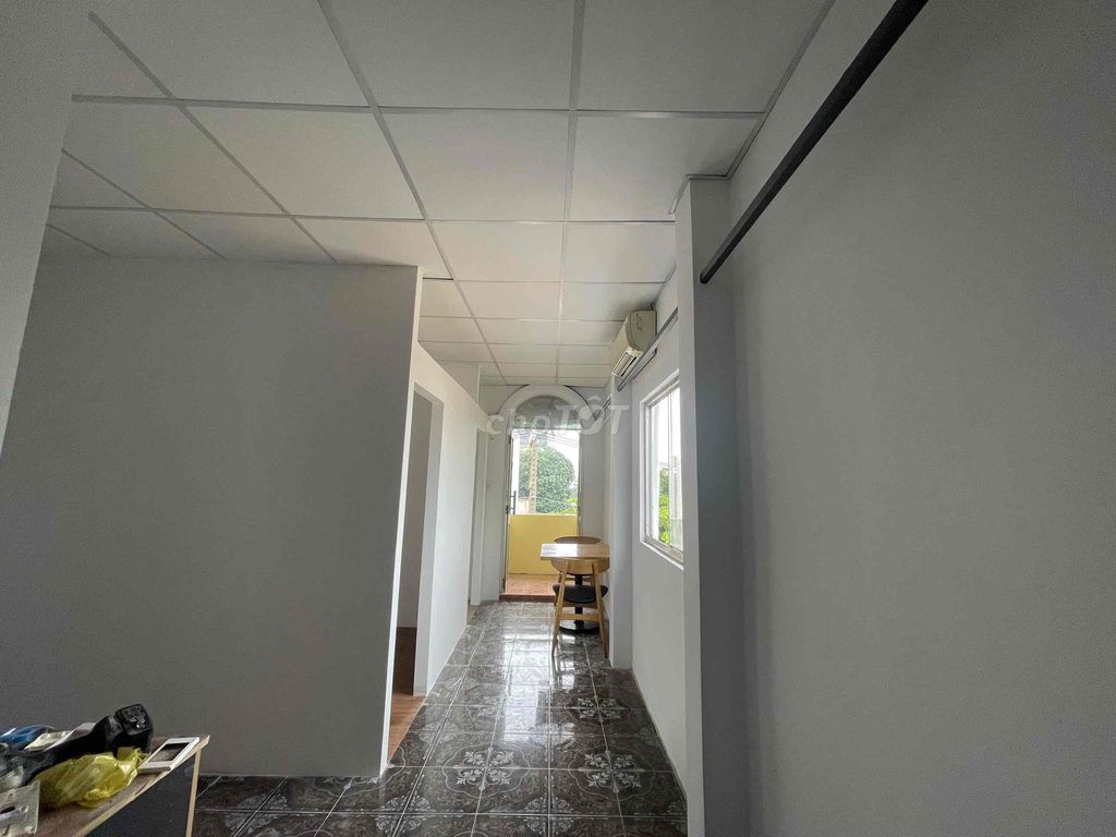 Two bedrooms with a balcony full of furniture