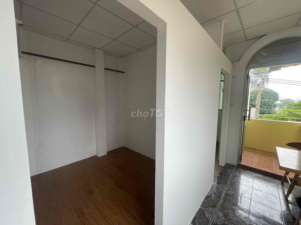 Two bedrooms with a balcony full of furniture