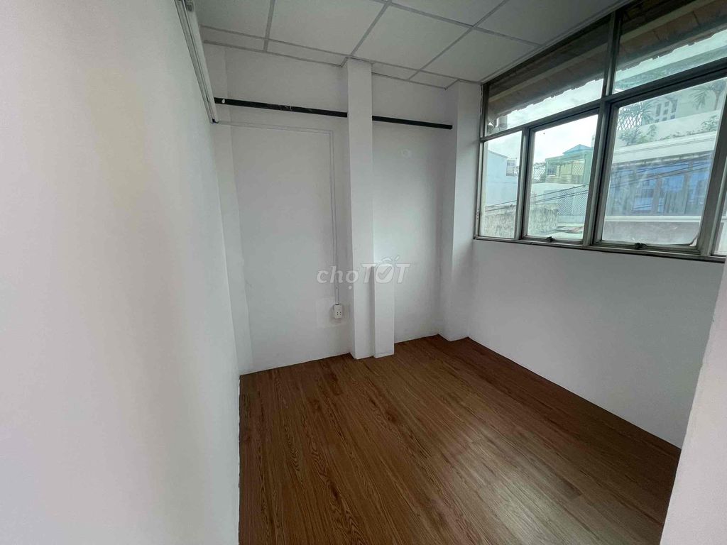 Two bedrooms with a balcony full of furniture
