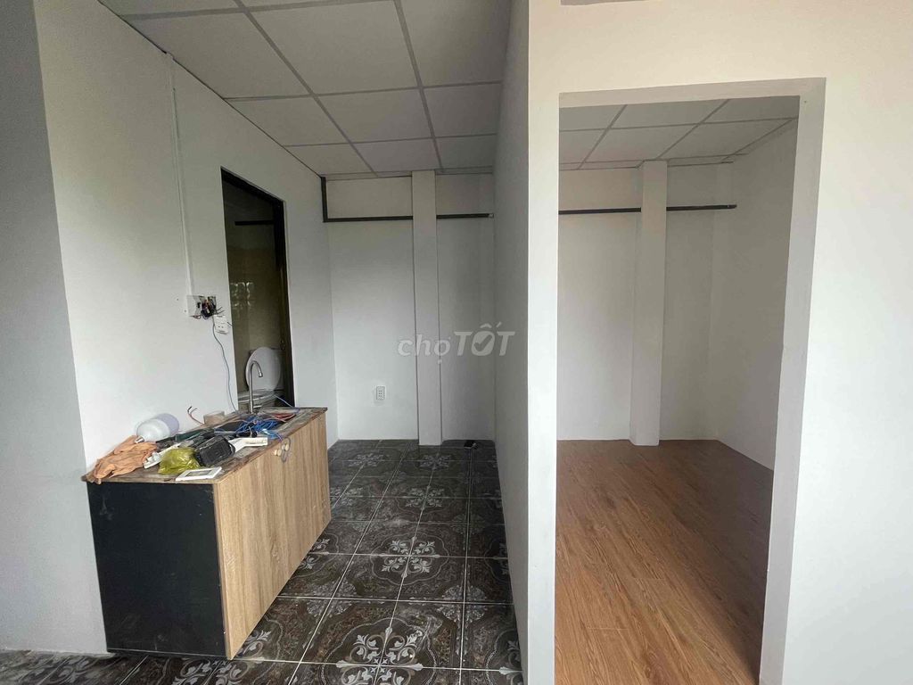 Two bedrooms with a balcony full of furniture