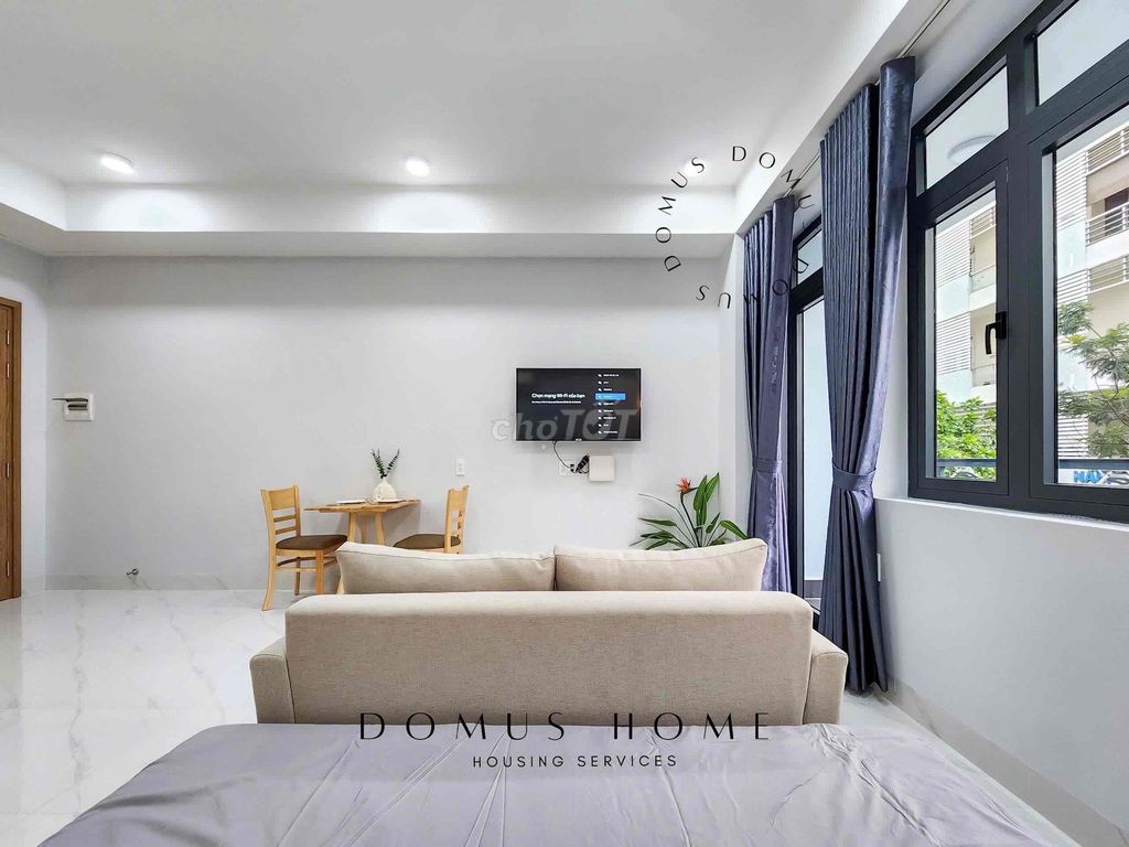 The studio is full of furniture, balconys, open windows in the center of District 7