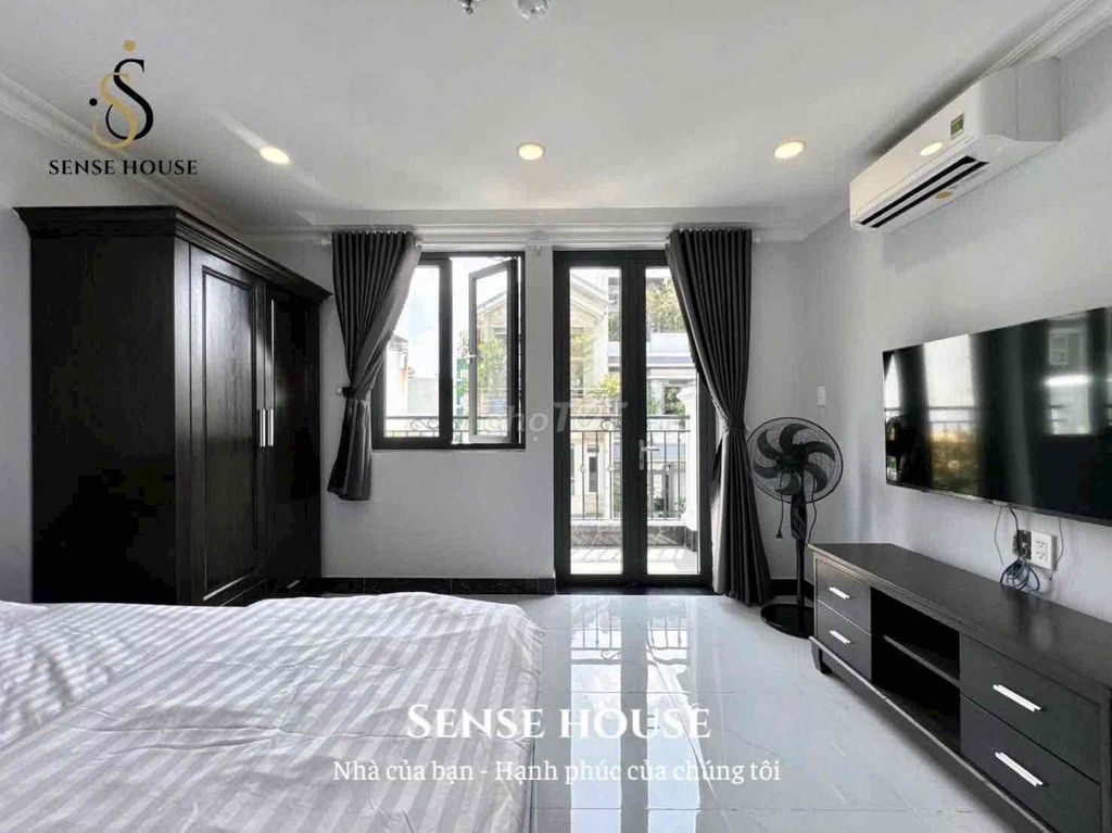 The service apartment. A balcony bedroom. A washing machine.