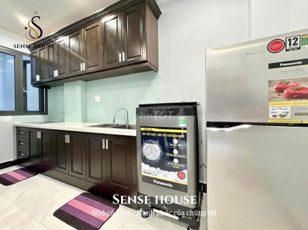The service apartment. A balcony bedroom. A washing machine.