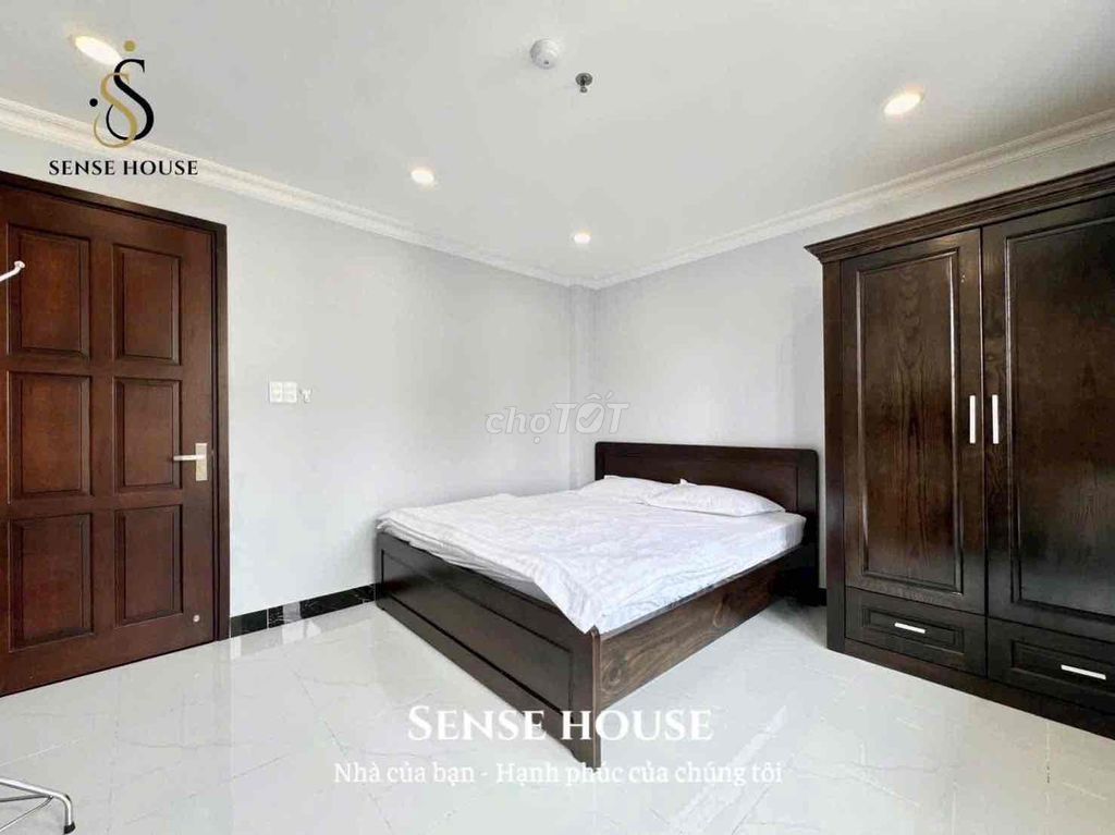 The service apartment. A balcony bedroom. A washing machine.