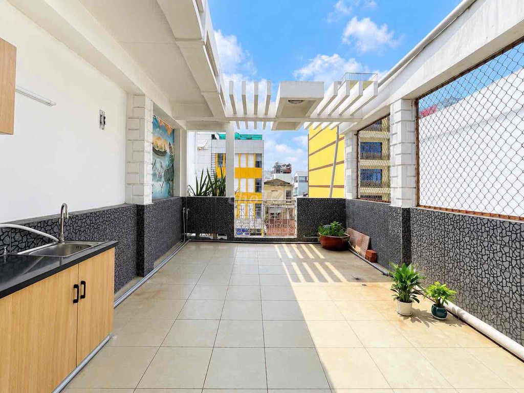 The garden balcony studio is right near the rich stadium's shower.