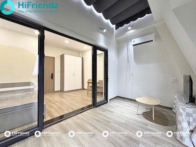 The studio is full of furniture, open room, lots of light.