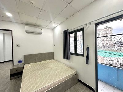 A full interior bedroom with a free kitchen.