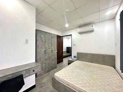 A full interior bedroom with a free kitchen.