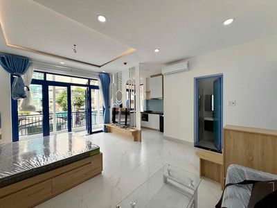 A Trần Hưng Đạo balcony bedroom in 1st, downtown, high-end interior.