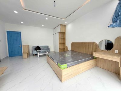 A Trần Hưng Đạo balcony bedroom in 1st, downtown, high-end interior.