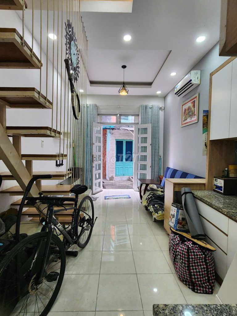 The beautiful little house on the floor right now with the holy writing.