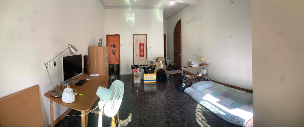 The empty room has a balcony and a large window