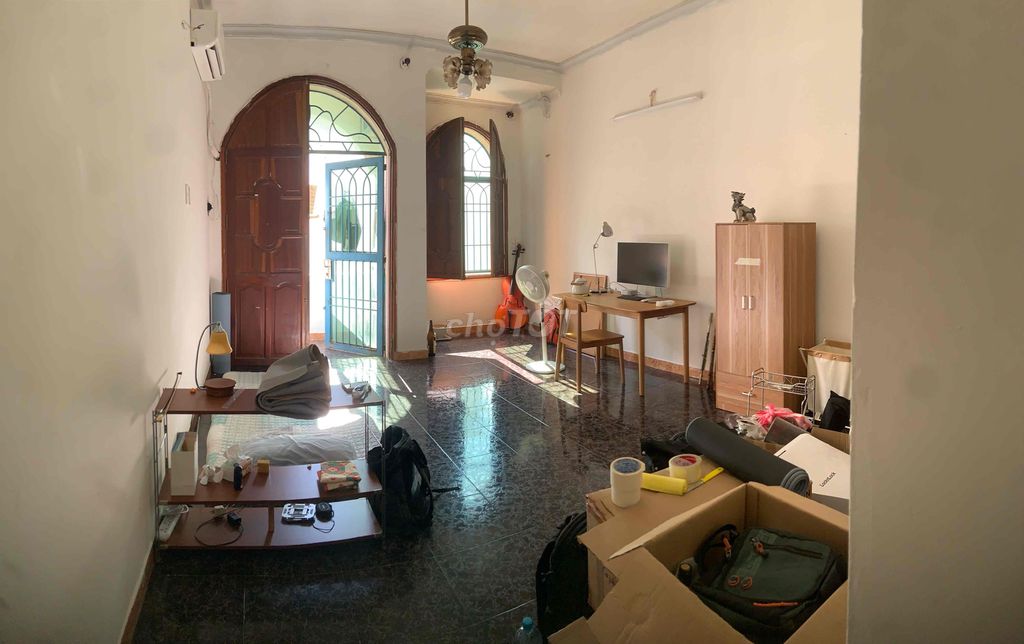 The empty room has a balcony and a large window
