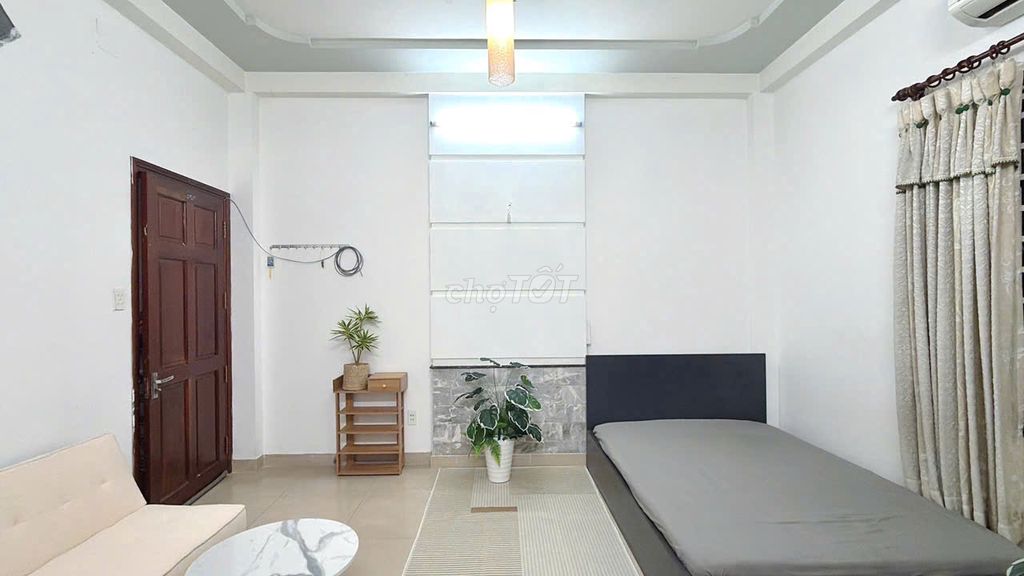 Clean motel, open window, cheap Tân Bình airport.