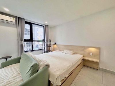 Rent a balcony studio full of furniture right next to the Saigon bridge.