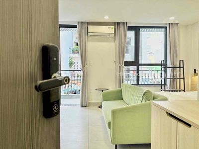 Rent a balcony studio full of furniture right next to the Saigon bridge.