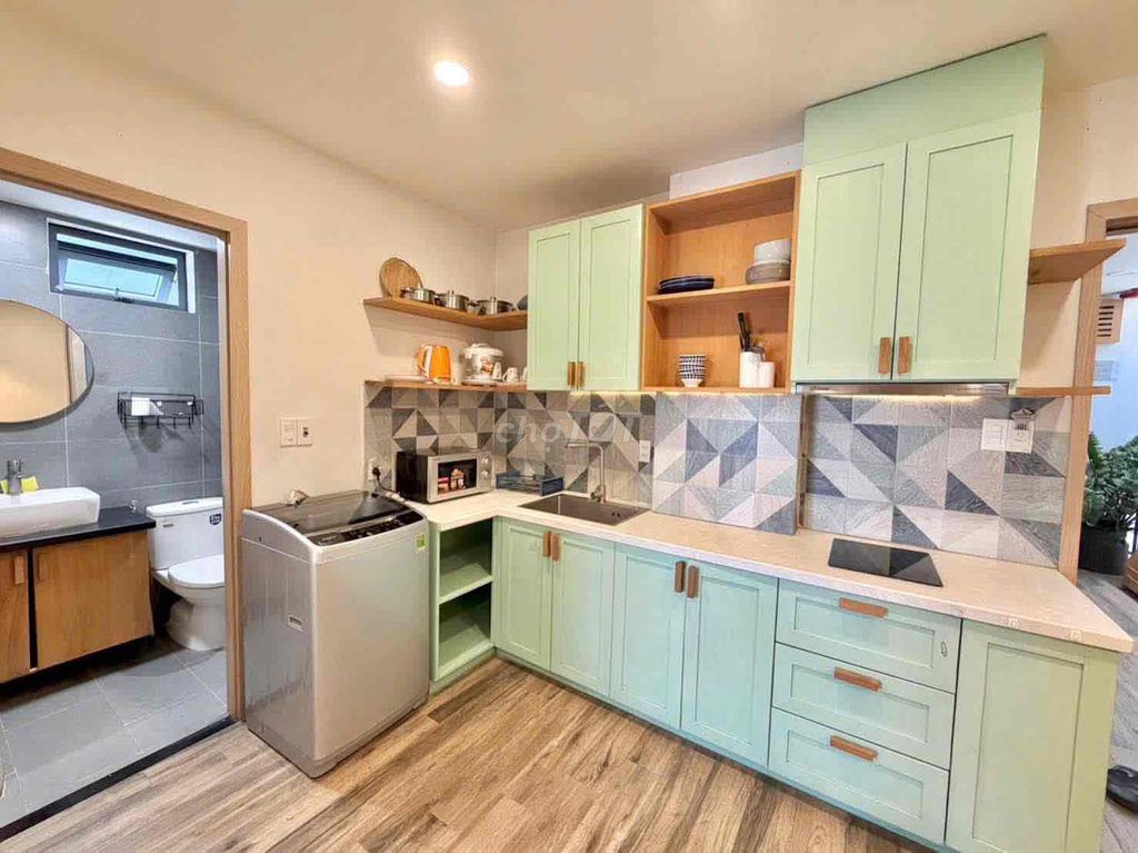 One bedroom, one living room, one large window.