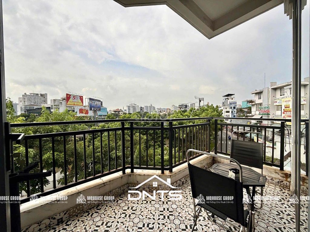 County Inn One is full of river-view balcony furniture. Near Tân Định Market