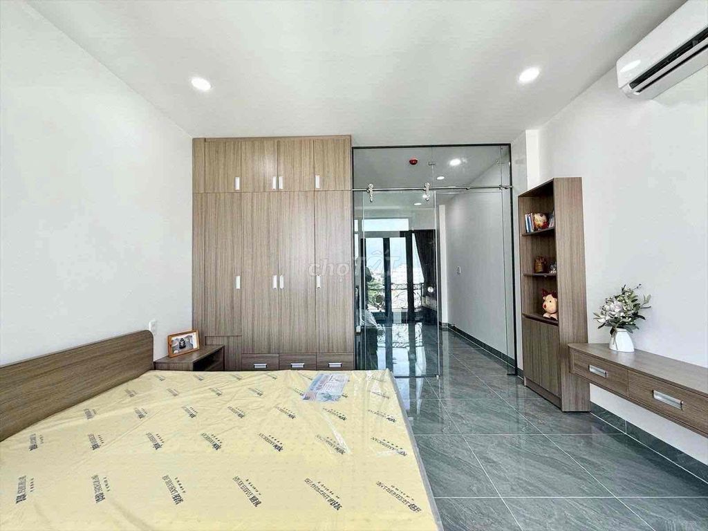 A bedroom-a full interior balcony.