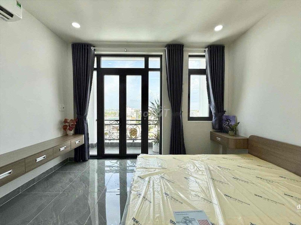 A bedroom-a full interior balcony.