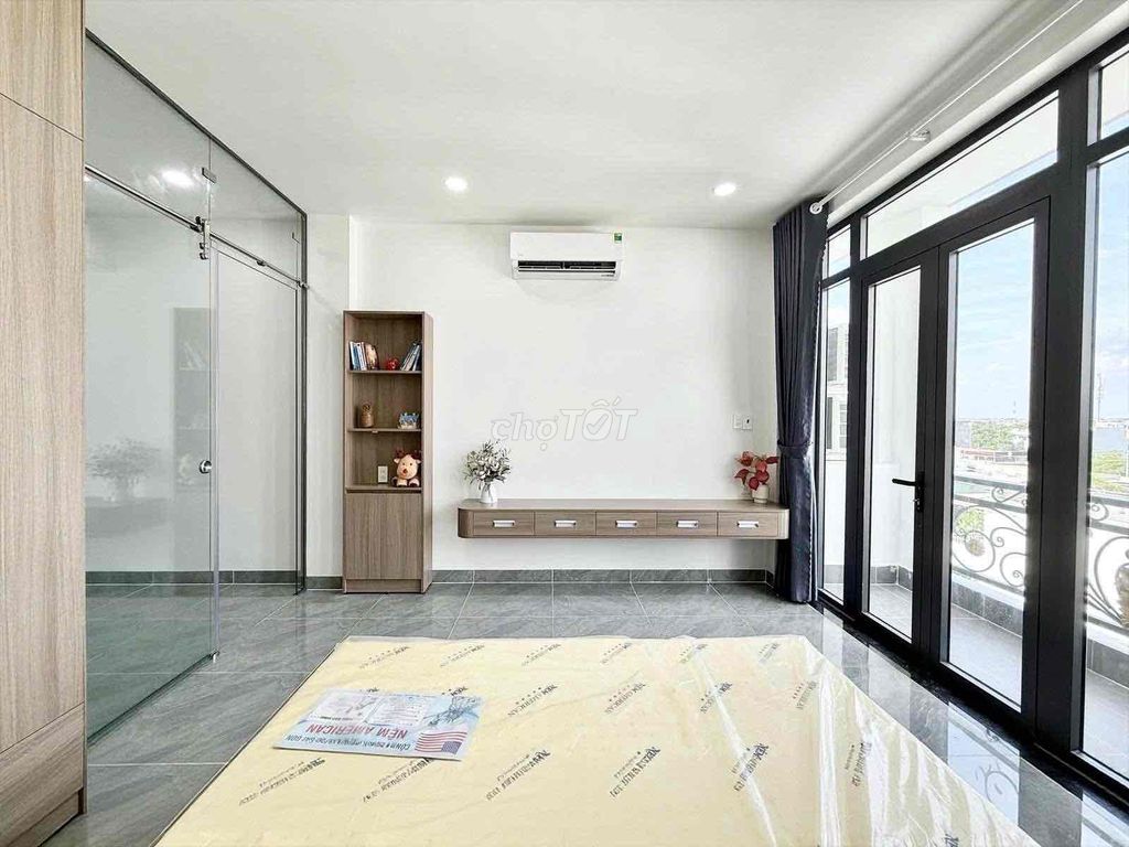 A bedroom-a full interior balcony.
