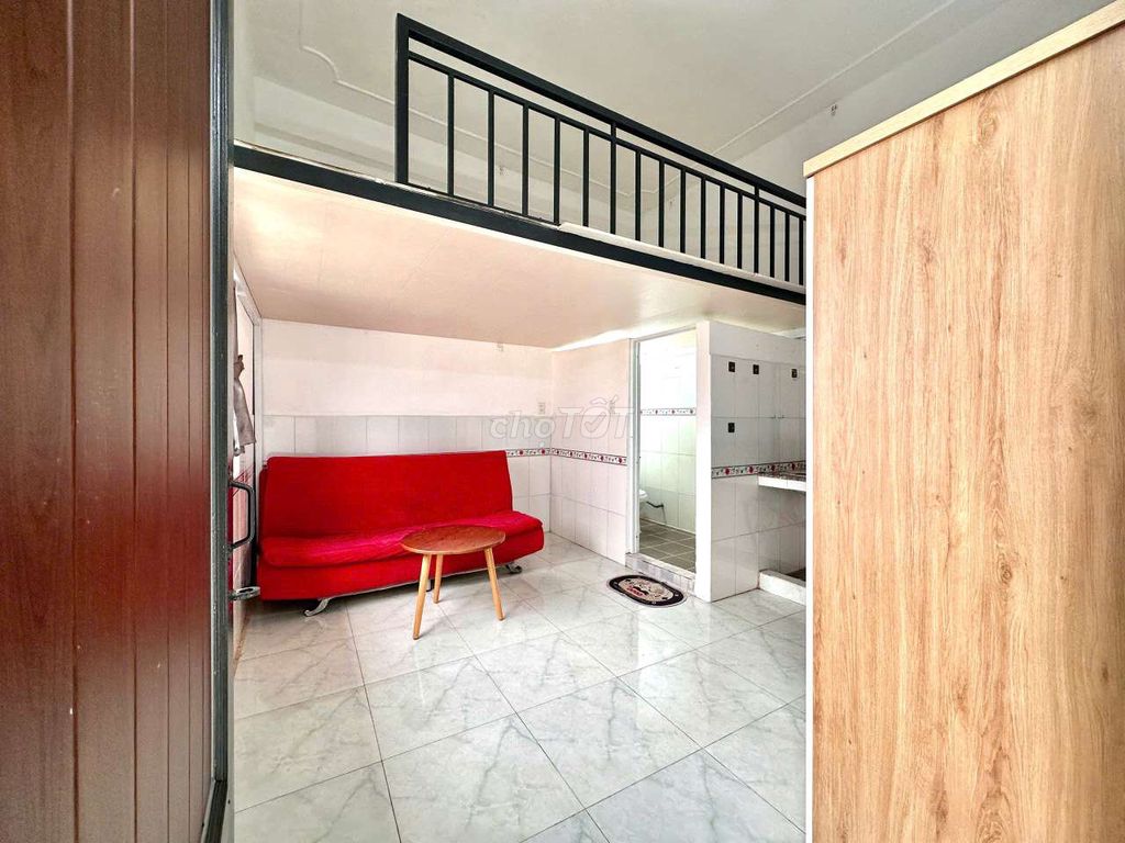 - Full interior with extremely red sofa.