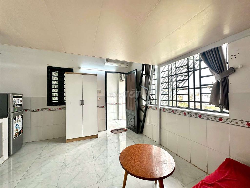 - Full interior with extremely red sofa.