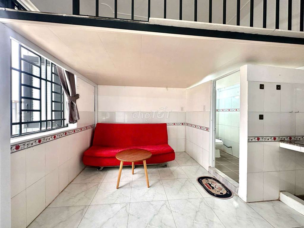 - Full interior with extremely red sofa.