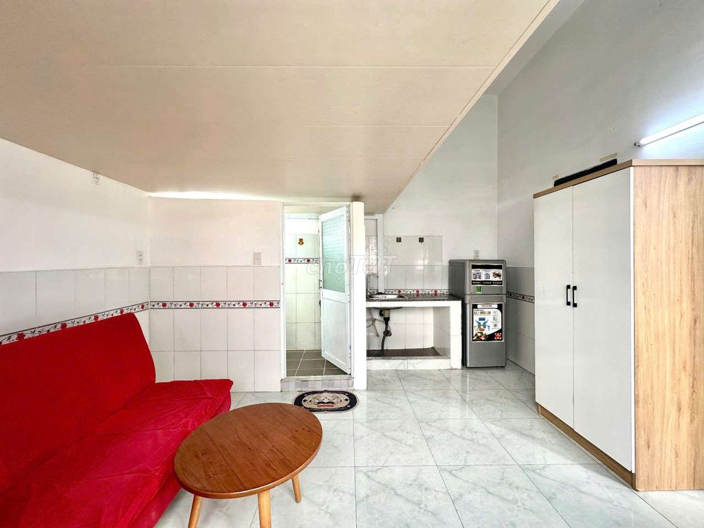 - Full interior with extremely red sofa.