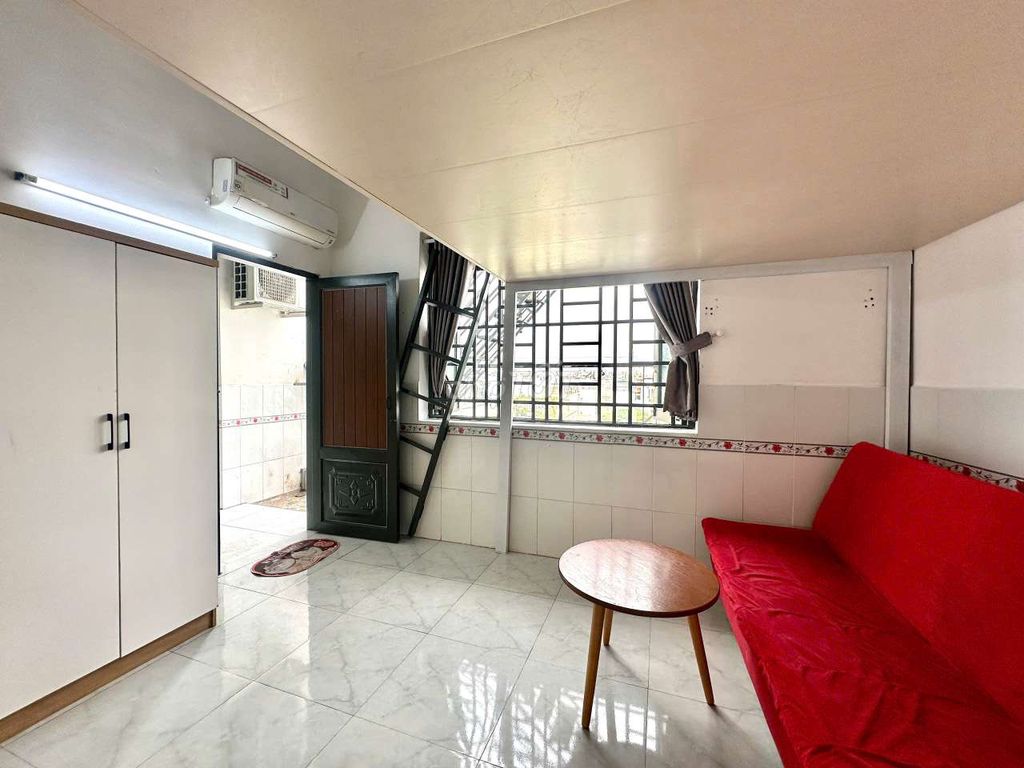 - Full interior with extremely red sofa.