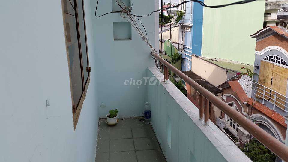 Room 14 meters with balcony, open windows, refrigerators.