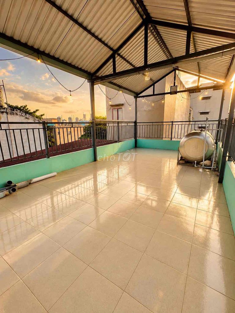 The entire second floor has a broad balcony with a roof.