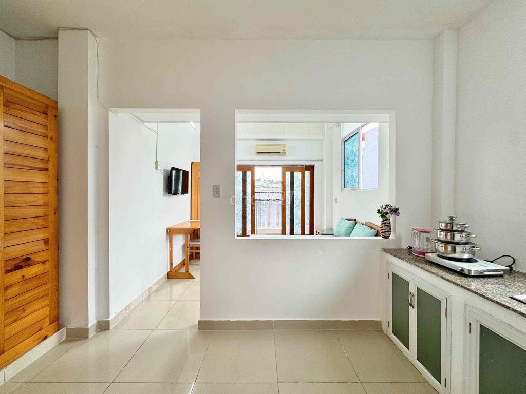 Right in the middle of a super open kitchen room right next to T3 station.