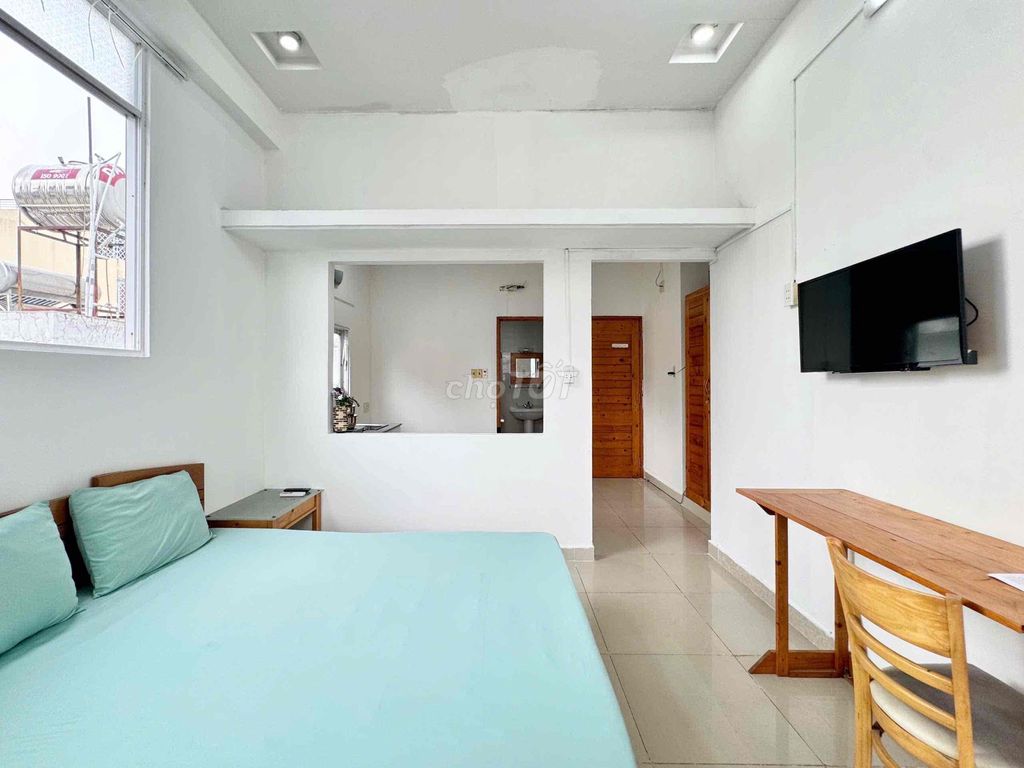Right in the middle of a super open kitchen room right next to T3 station.