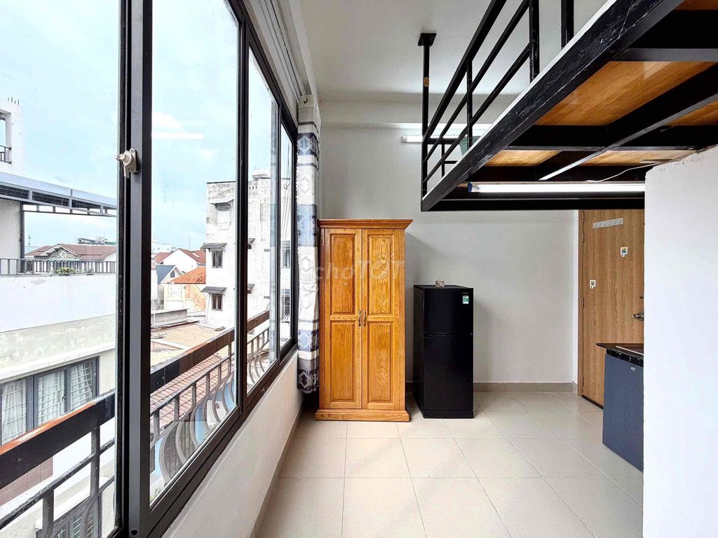 The balcony is full of furniture in blue.